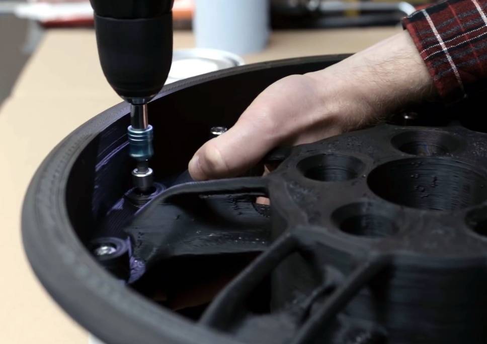 Bolts hold the two halves of the rim together.