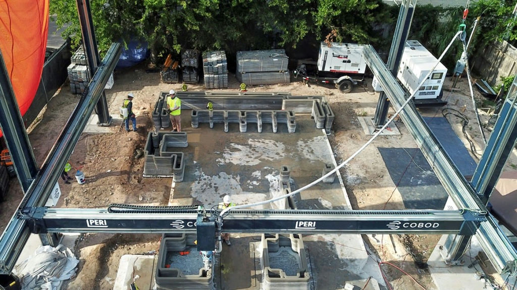 A construction 3D printer gantry is helping to build a Houston home that will be the first multistory 3D-printed structure in the U.S., also incorporating wood framing in a new hybrid design.