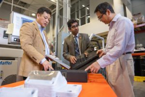 Srikanth Pilla, center, works in the Clemson Composites Center with Gang Li, left, and Feng Luo.