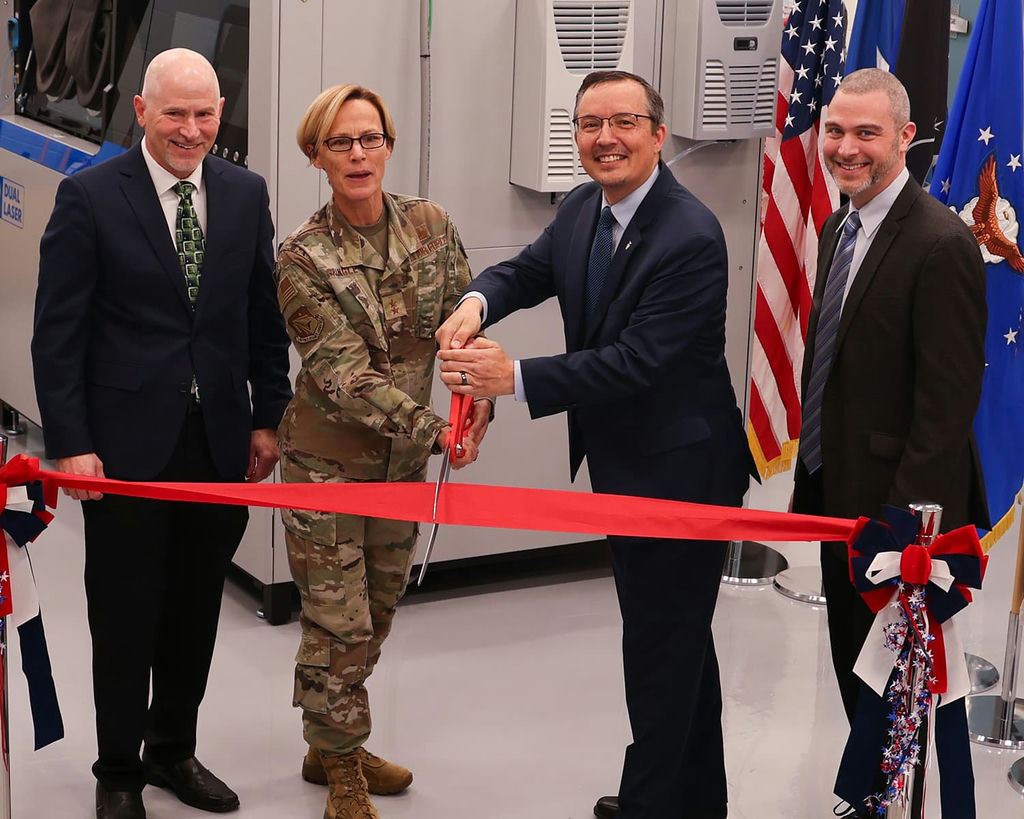 Air Force Research Laboratory Commander Maj. Gen. Heather Pringle and AFRL Materials and Manufacturing Director Darrell Phillipson cut a ribbon during a ceremony celebrating the reopening of the Additive Manufacturing Laboratory at Wright-Patterson Air Force Base, Ohio, Nov. 9, 2022. Technical Lead John Brausch and Research Materials Engineer Dr. Edwin Schwalbach, far right, oversaw extensive facility renovations and the addition of state-of-the-art equipment. (U.S. Air Force photo / Jonathan Taulbee)