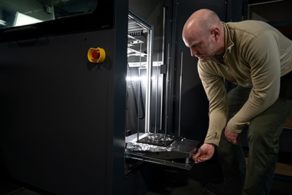 Devin Young demonstrates the new Impossible Objects CBAM 3D Printer at Weber State University’s Miller Advanced Research and Solutions Center on January 6, 2023.