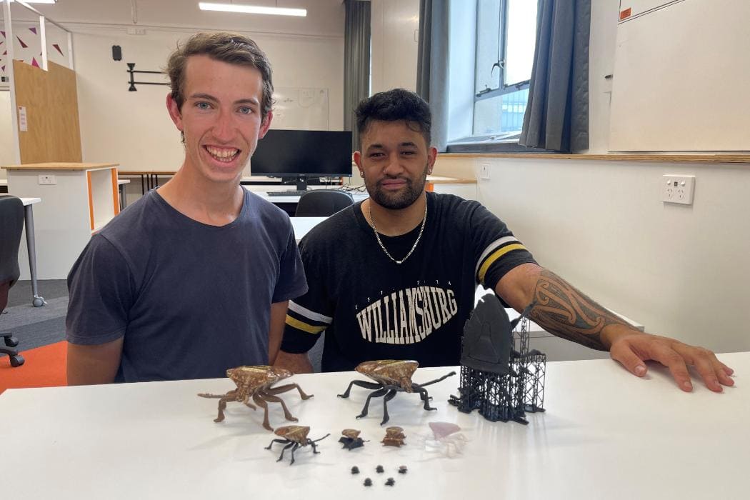 University of Canterbury students Joel Tregurtha and Te Matau O Te Rangi Allen with the 3D prototype of the brown marmorated stink bug model they’ve made.